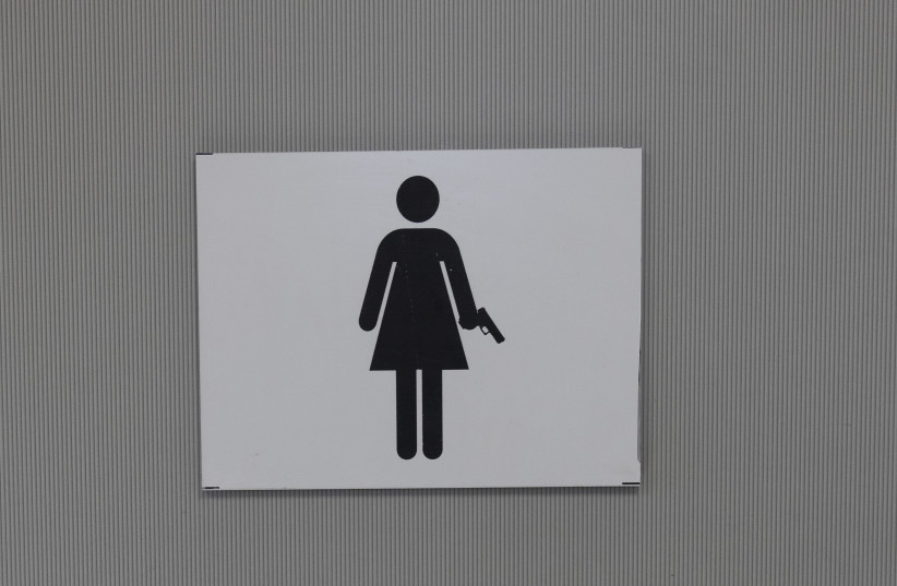  The sign for the women's bathroom at Caliber 3. (credit: MARC ISRAEL SELLEM/THE JERUSALEM POST)