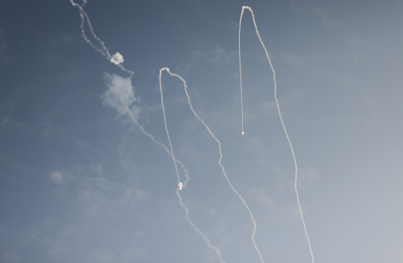 ROCKETS LAUNCHED from the Gaza Strip are intercepted by the Iron Dome air defense system, leaving smoke trails as seen in the skies over Ashkelon, during an attack last month (credit: Chaim Goldberg/Flash90)