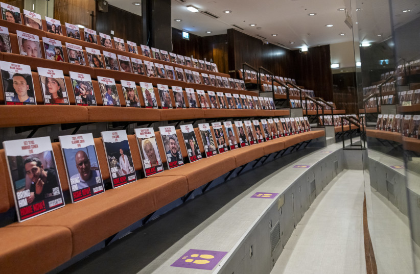  Photos of the Gaza hostages adorn the Knesset plenum, November 7, 2023 (credit: NOAM MOSKOVITZ/KNESSET)