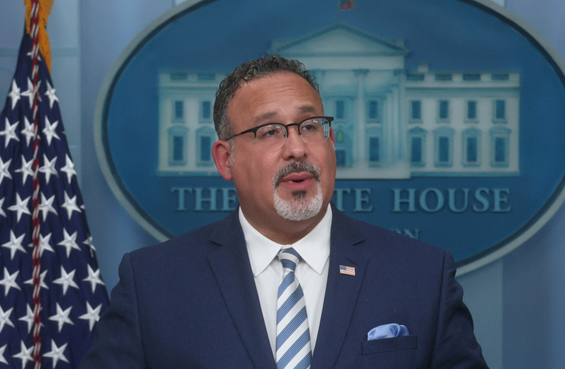  U.S. Secretary of Education Miguel Cardona takes part in a press briefing with White House Press Secretary Karine Jean-Pierre about student loan debt at the White House in Washington, U.S., June 30, 2023. (credit: REUTERS/LEAH MILLIS)