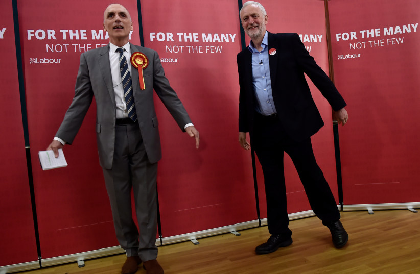Britain's opposition Labour Party leader Jeremy Corbyn stands with local Labour candidate Chris Williamson (L) during an election campaign event in Derby, Britain May 6, 2017. (credit: Hannah McKay/Reuters)