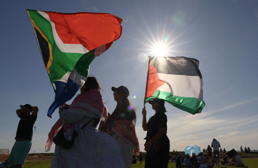  People hold Palestinian and South African flags during a demonstration in support of Palestinians at Three Anchor Bay in Cape Town, South Africa, October 22, 2023. (credit: ESA ALEXANDER/REUTERS)