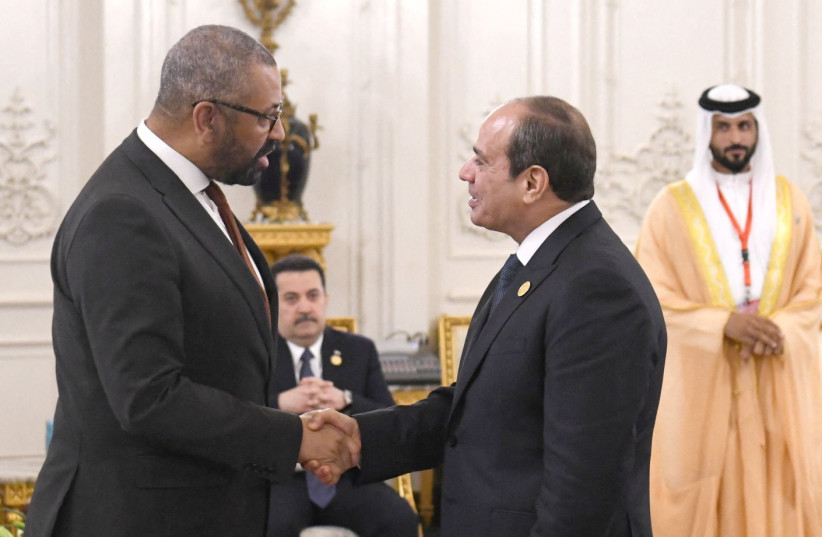  Egyptian President Abdel Fattah al-Sisi greets British Foreign Secretary James Cleverly during the Cairo international summit for peace in the Middle East, in the New Administrative Capital (NAC), east of Cairo, Egypt, October 21, 2023. (credit: THE EGYPTIAN PRESIDENCY/HANDOUT VIA REUTERS)