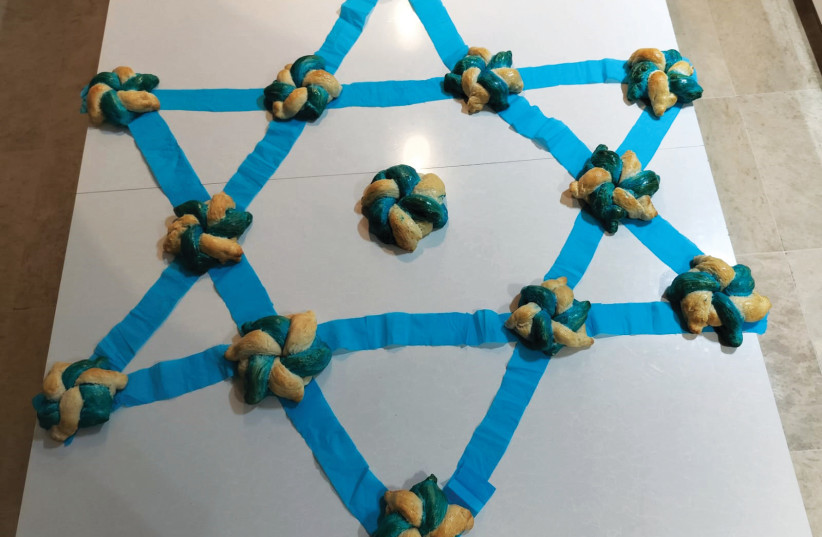  BLUE-AND-WHITE rolls arranged in the shape of the Star of David. (credit: HEDY RASHBA)