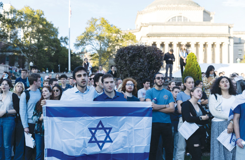  STUDENTS DEMONSTRATE in support of Israel at Columbia University in New York City, last month. All Israelis have been moved to see how Jews from around the world have stood up to assist Israel during this difficult time. (credit: JEENAH MOON/REUTERS)
