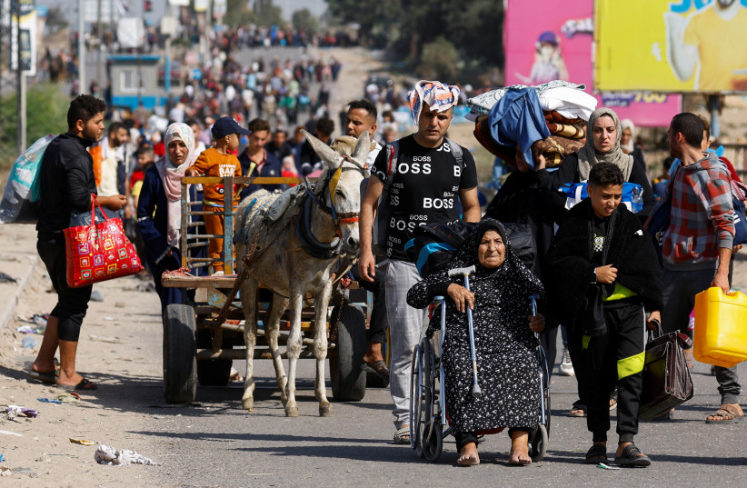  Palestinians fleeing north Gaza move southward as Israeli tanks roll deeper into the enclave, amid the ongoing conflict between Israel and Hamas, in the central Gaza Strip November 10, 2023.  (credit:  REUTERS/Ibraheem Abu Mustafa)
