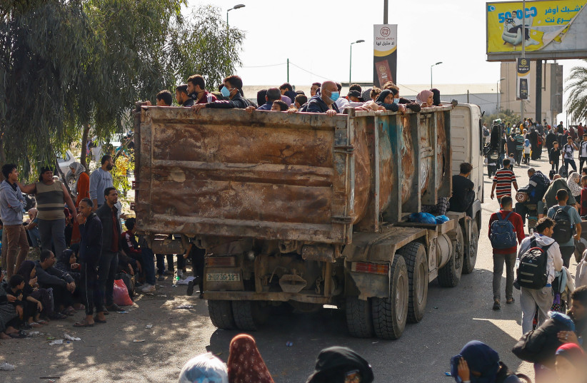  Palestinians fleeing north Gaza move southward as Israeli tanks roll deeper into the enclave, amid the ongoing conflict between Israel and Hamas, in the central Gaza Strip November 10, 2023.  (credit:  REUTERS/Ibraheem Abu Mustafa)