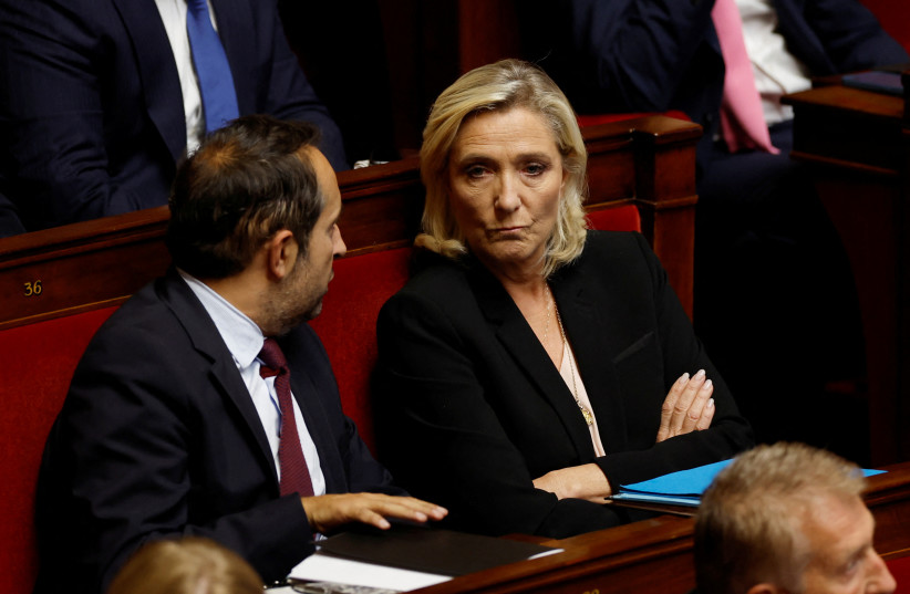  Marine Le Pen, member of parliament and president of the French far-right National Rally (Rassemblement National - RN) party parliamentary group, and and member of parliament Sebastien Chenu attend the questions to the government session at the National Assembly in Paris, France, October 10, 2023.  (credit: REUTERS/GONZALO FUENTES)