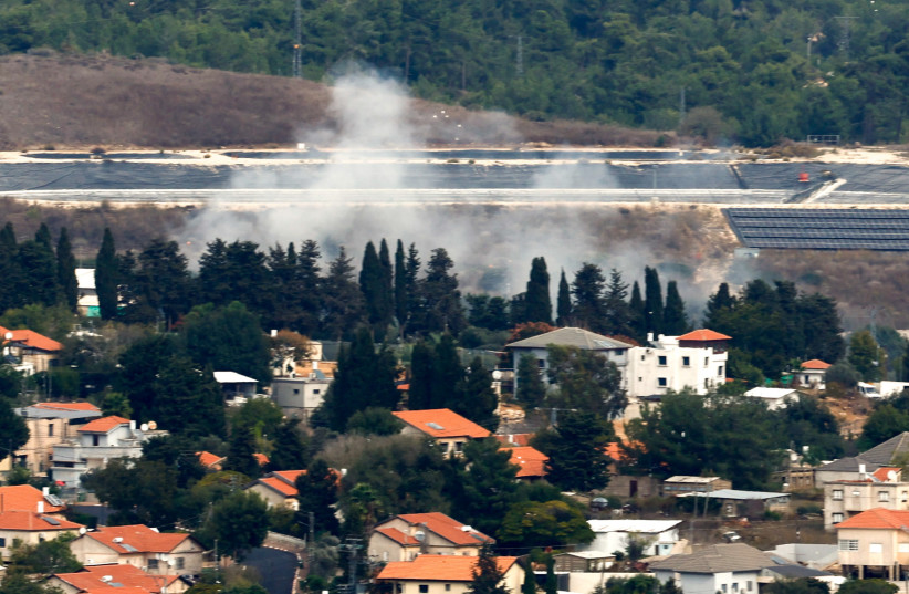  Smoke rises behind the village of Dovev as seen from Israel-Lebanon border in northern Israel, November 12, 2023 (credit: REUTERS/EVELYN HOCKSTEIN)