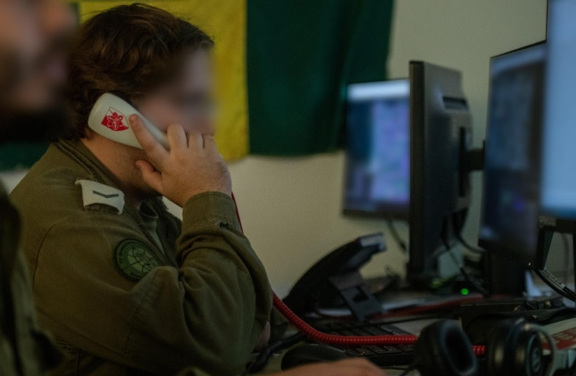 IDF soldiers are seen working as part of the Israeli military's Gaza battlefield intelligence collection unit. (IDF SPOKESPERSON'S UNIT)
