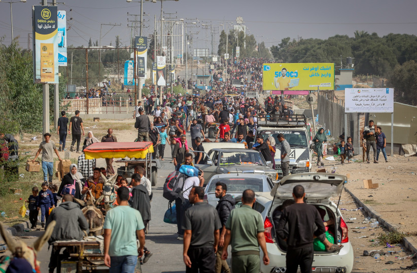  Palestinians walk on a main road after fleeing from their homes in Gaza City to the southern part of Gaza, November 10, 2023. (credit: ATIA MOHAMMED/FLASH90)