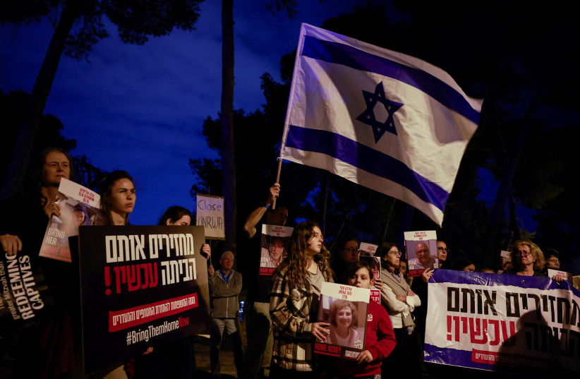  People gather in front of the United Nations Headquarters in Jerusalem demanding for action to be taken to return the hostages kidnapped by Hamas during the October 7 attacks, in Jerusalem November 13, 2023.  (credit: REUTERS/AMMAR AWAD)