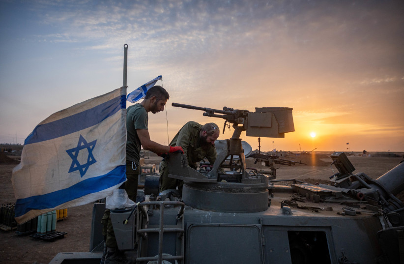 Israeli reserve soldiers seen at their artillery unit stationed near the Gaza border, in southern Israel, November 13, 2023 (credit: YONATAN SINDEL/FLASH90)
