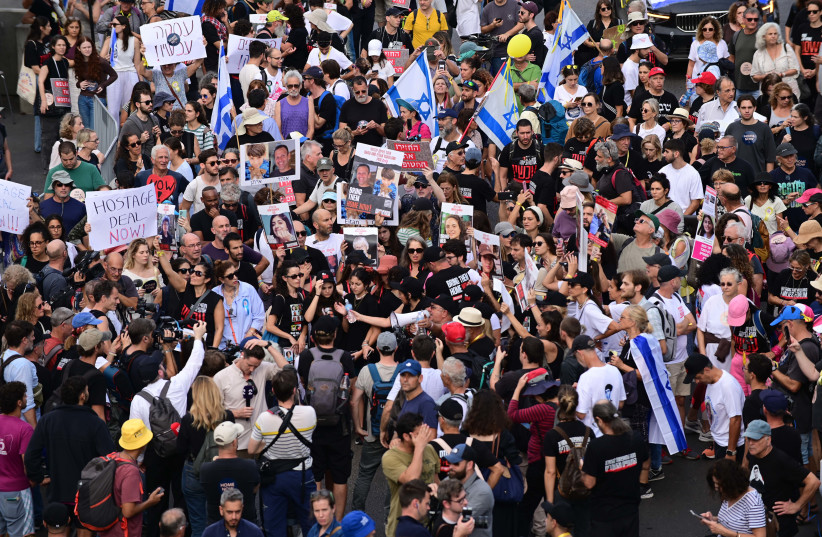  Israelis march in Tel Aviv towards the Israeli parliament in Jerusalem, as part of a protest for the release of Israelis held kidnapped by Hamas terrorists in Gaza on November 14, 2023. (credit: TOMER NEUBERG/FLASH90)
