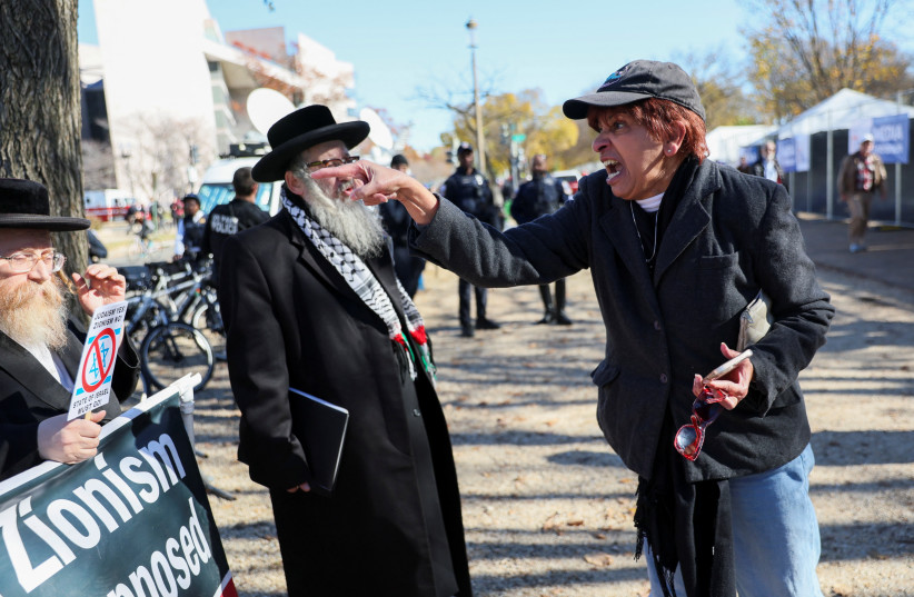  A woman yells at members of the Neturei Karta, a group opposed to Zionism and Israel, on the day of a rally in solidarity with Israel and against antisemitism, amid the ongoing war between Israel and Hamas, during a rally on the National Mall in Washington, US November 14, 2023. (credit: Leah Mills/Reuters)