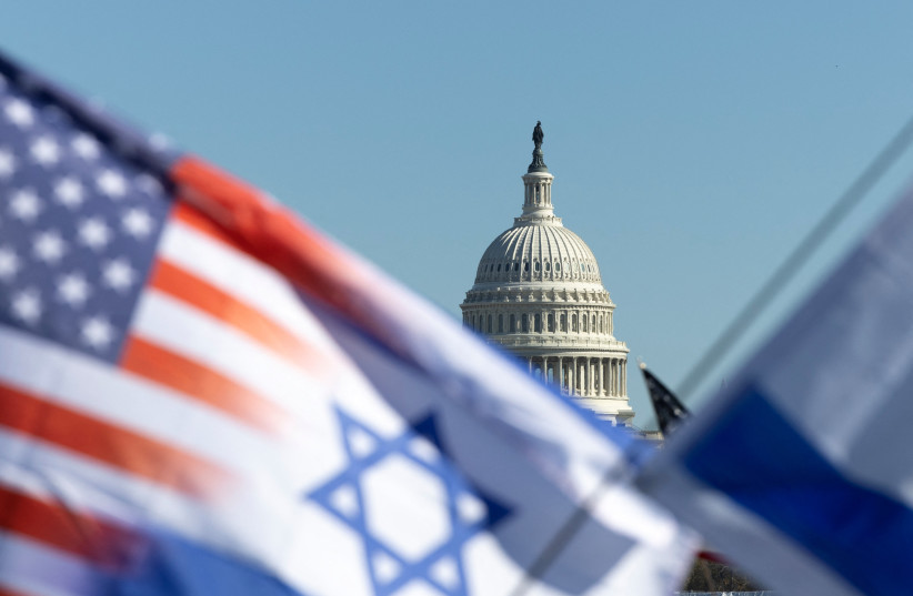  Israel and American flags are flown near the US Capitol during a rally in support of Israel and protest against antisemitism on the National Mall in Washington, November 14, 2023. (credit: TOM BRENNER/REUTERS)