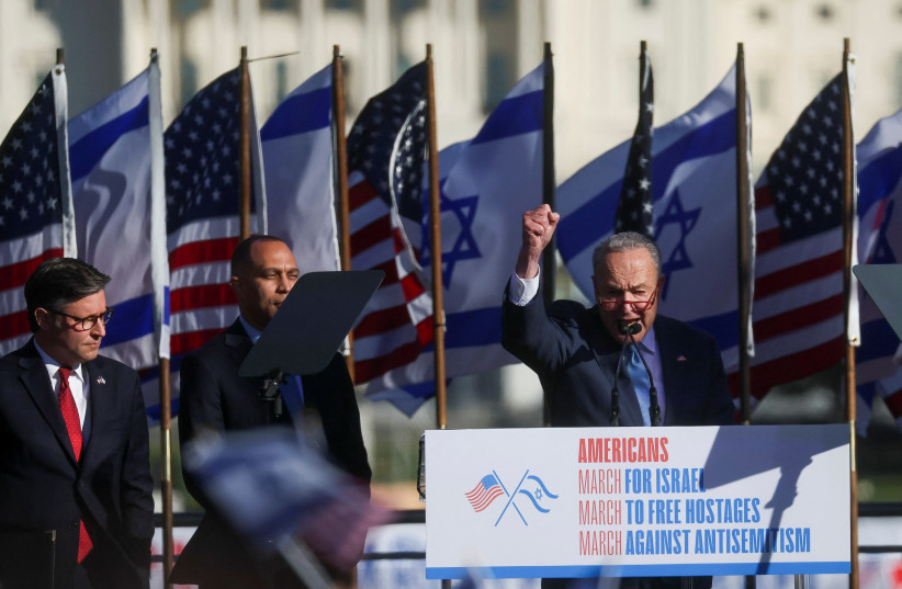  US Senate Majority Leader Chuck Schumer next to House Speaker Mike Johnson and House Democratic Leader Hakeem Jeffries, as supporters of Israel gather in solidarity and protest against antisemitism, amid the war with Hamas, during a rally on the National Mall in Washington, US November 14, 2023. (credit: Leah Mills/Reuters)