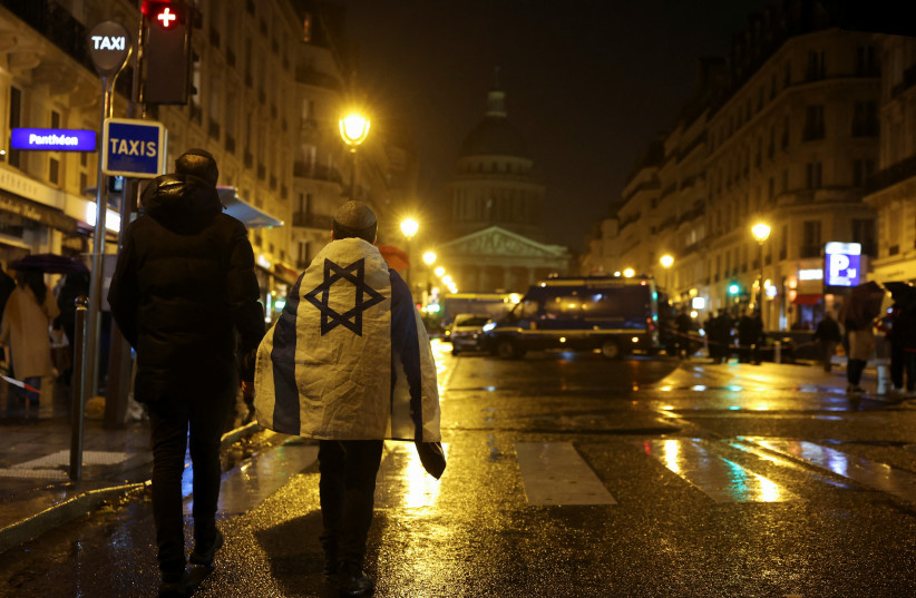  A boy wears an Israeli flag, while he walks in front of the Pantheon, on the day of a demonstration against antisemitism, amid the ongoing conflict between Israel and Hamas, in Paris, France November 12, 2023. (credit: Claudia Greco/Reuters)