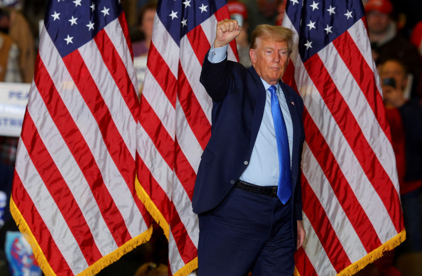  FILE PHOTO: Republican presidential candidate and former U.S. President Donald Trump gestures during a campaign rally in Claremont, New Hampshire, U.S., November 11, 2023. (credit: REUTERS/BRIAN SNYDER/FILE PHOTO)