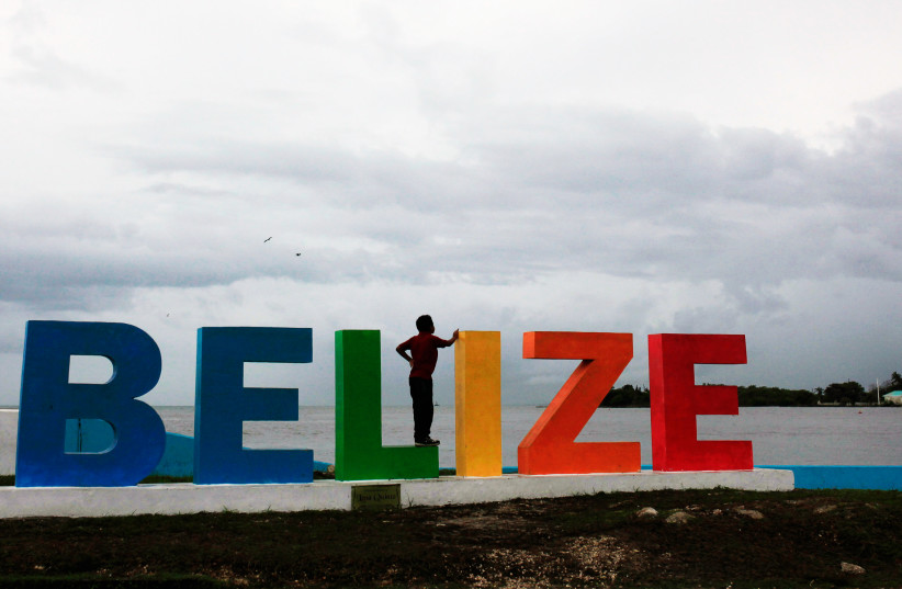  People gather on a touristic boardwalk in Belize City, Belize June 22, 2016. (credit: REUTERS/Jose Cabezas/File Photo)