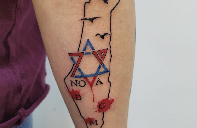 Miki's tattoo immortalizes the tragic events of October 7 (credit: Miki Cohen)