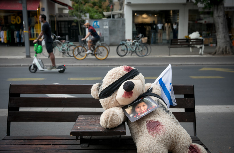  Blindfolded large teddy bears with red paint on them depicting blood and photographs of Israeli children held hostage by Hamas terrorists in Gaza since the October 7 massacre, in Tel Aviv, November 13, 2023.  (credit: MIRIAM ALSTER/FLASH90)