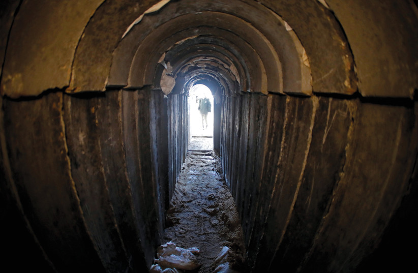  A view of a cross-border attack tunnel dug from Gaza to Israel.  (credit: Jack Guez/Pool/REUTERS)
