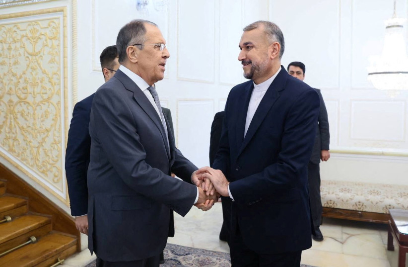 Russian Foreign Minister Sergei Lavrov shakes hands with Iranian Foreign Minister Hossein Amir-Abdollahian during the second 3+3 Regional platform summit in Tehran, Iran October 23, 2023 (credit: RUSSIAN FOREIGN MINISTRY/HANDOUT VIA REUTERS)
