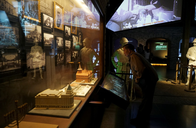 A visitor looks at the display at the Shanghai Jewish Refugee Museum in Shanghai, China November 17, 2023.  (credit: REUTERS)