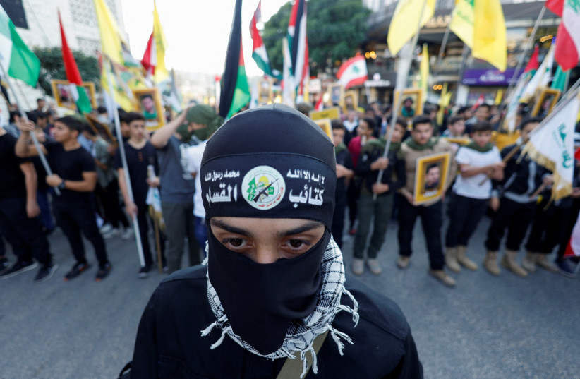  Lebanese Hezbollah supporters attend a protest in support of Palestinians in Gaza, amid the ongoing conflict between Israel and the Palestinian Islamist group Hamas, in Nabatieh, southern Lebanon November 18, 2023 (credit: REUTERS/ALAA AL-MARJANI)