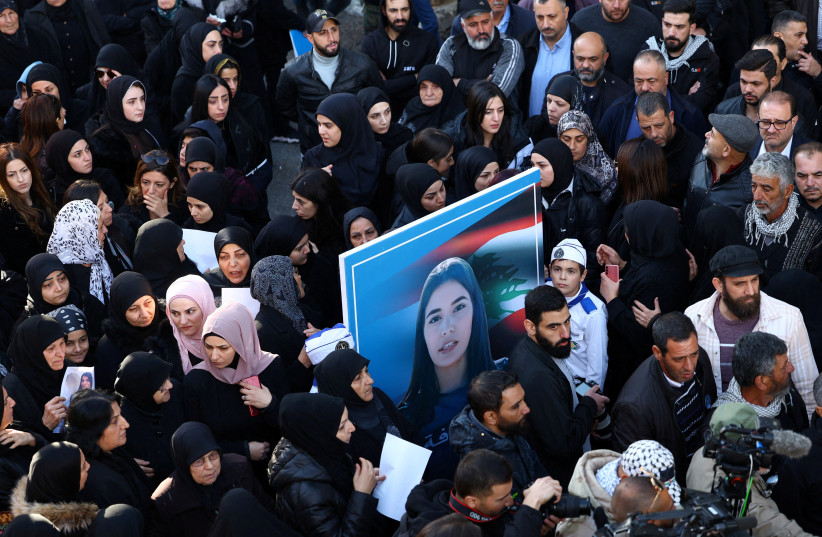 Mourners hold a picture of Farah Omar, Lebanon-based Al Mayadeen TV channel correspondent, who was killed along with Al Mayadeen cameraman Rabih al-Maamari by what their channel said was an Israeli strike in southern Lebanon, during her funeral in Mashghara, Lebanon, November 22, 2023.