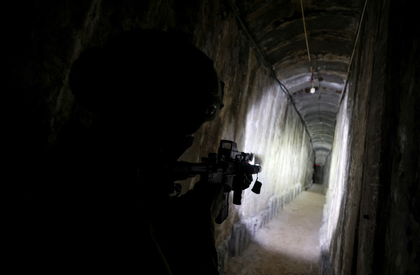  An IDF soldier secures a tunnel underneath Al Shifa Hospital in Gaza City, amid the ongoing ground operation of the Israeli army against Palestinian Islamist group Hamas, in the northern Gaza Strip, November 22, 2023. (credit: RONEN ZVULUN/REUTERS)