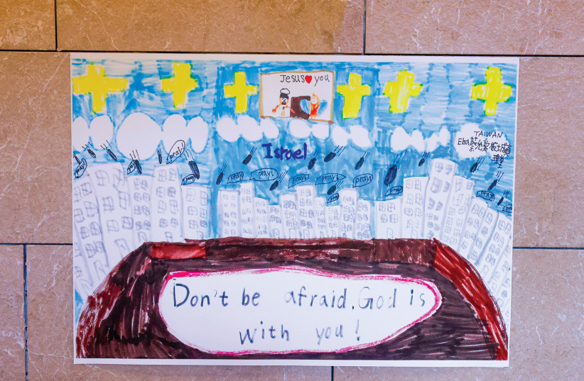  UNIVERSAL MESSAGES of peace, encouragement, and unity are a leitmotif of the Taiwanese and Czech children’s drawings. (credit: MARC ISRAEL SELLEM)
