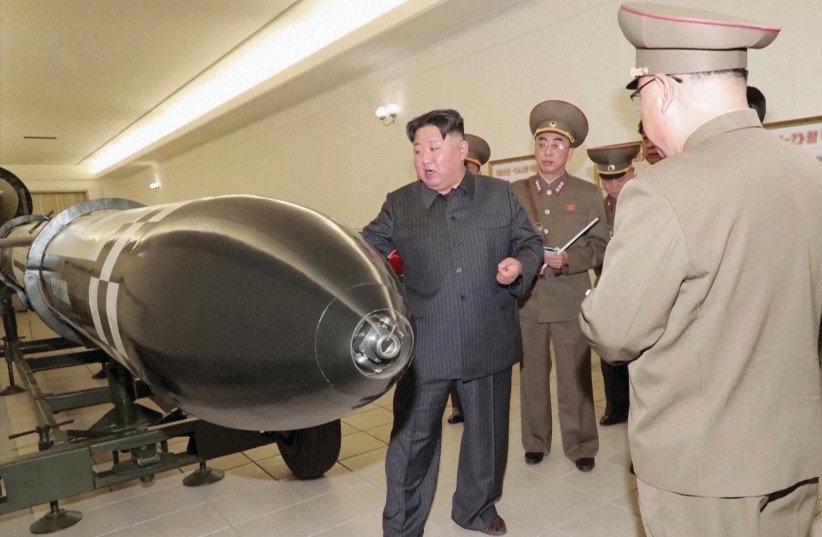  NORTH KOREAN leader Kim Jong Un inspecting nuclear warheads at an undisclosed location.  (credit: KRT/via Reuters TV/Handout via Reuters)