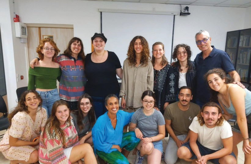  ACHINOAM NINI (NOA) (seated, 4th L)) and Gil Dor (standing, R) meet with Arava Institute students after their Kibbutz Ketura concert, Nov. 9. (credit: MICHAEL M. COHEN)