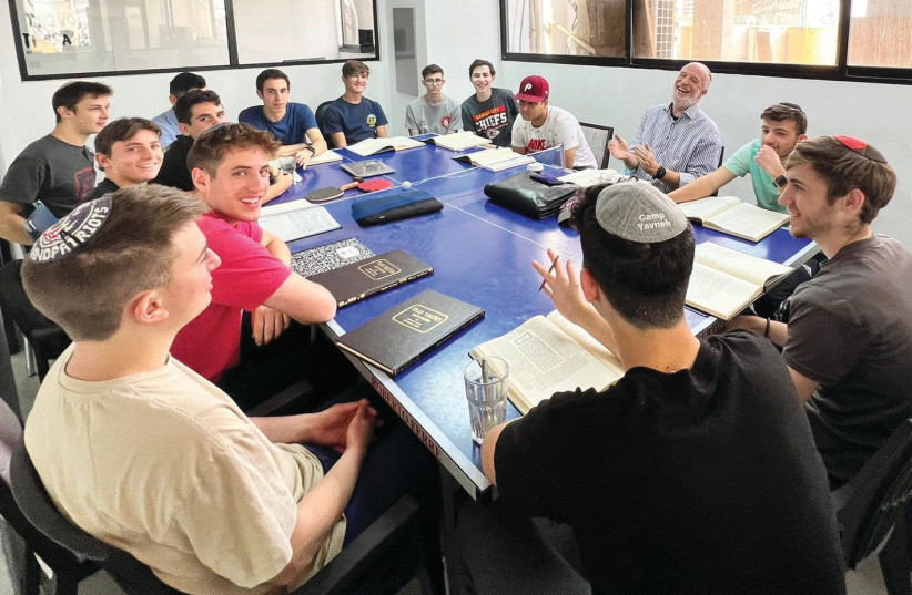  PEOPLE’S Talmud founder Gedaliah Gurfein (center R) teaches Talmud at Yeshiva Torah Tech, in Tel Aviv, 2023. Rabbi Gurfein teaches Talmud to communities all over the world via Zoom. (credit: People’s Talmud)