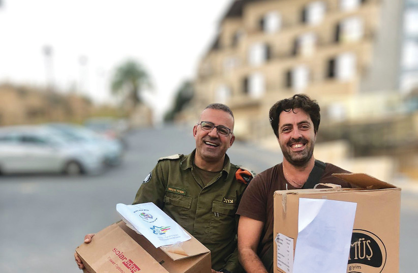  DR. AMIR KHNIFESS, chairman of the Israeli-Druze Center, and a soldier at a base in the North.  (credit: Amir Khnifess)