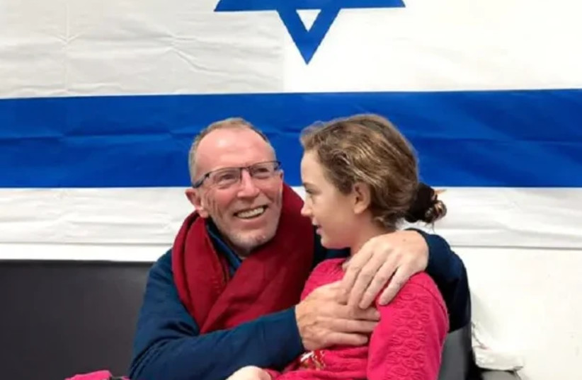  Thomas Hand embraces his daughter Emily after being reunited. (credit: Maariv Online)