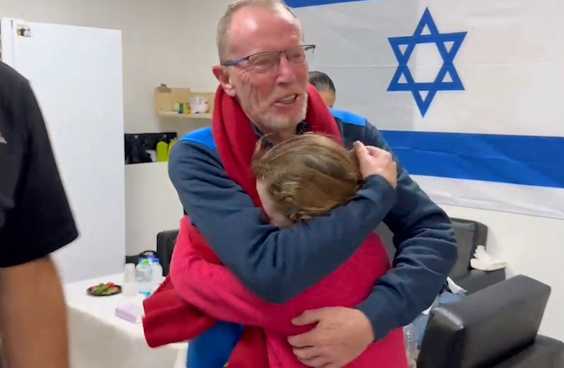  Irish-Israeli girl Emily Hand, who was abducted by Hamas terrorists during the October 7 attack on Israel, meets her father Thomas Hand after being released as part of a hostages-prisoners swap deal, November 26, 2023 (credit: Israel Defense Forces/Handout via REUTERS)