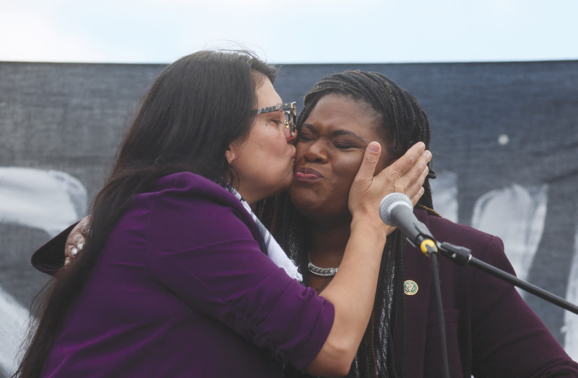  US REP. Rashida Tlaib (left) kisses Rep. Cori Bush as they take part in a protest outside the US Capitol in Washington last month, calling for a ceasefire in Gaza.  (credit: LEAH MILLIS/REUTERS)
