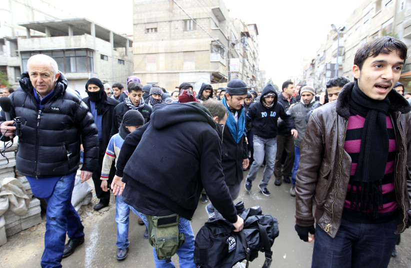  BBC correspondent Jeremy Bowen (L) is seen while working in Saqba (credit: REUTERS)