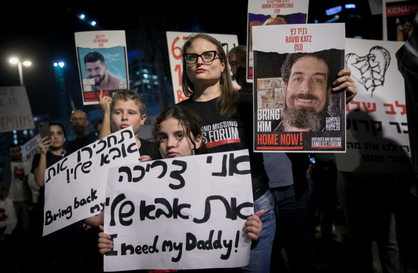  Israelis attend a rally calling for the release of Israelis held kidnapped by Hamas terrorists in Gaza at ''Hostage Square'' in Tel Aviv, November 25, 2023 (credit: MIRIAM ALSTER/FLASH90)