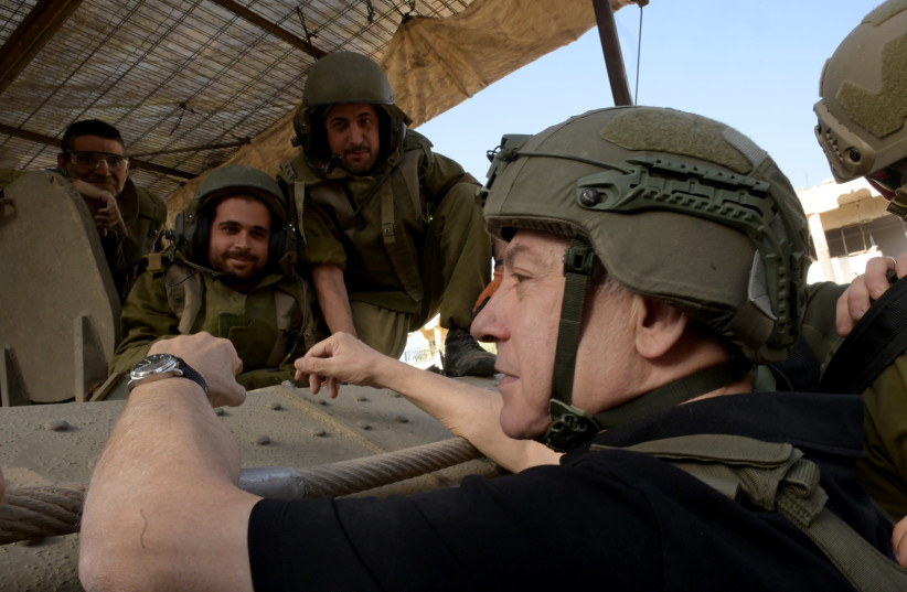  Prime Minister Benjamin Netanyahu seen with Israeli forces in the Gaza Strip on Sunday, November 25, 2023 (credit: GPO/AVI OHAYON)