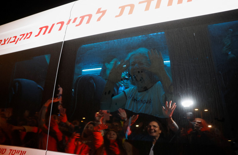  Aviva Adrienne Siegel, 62, who was released after being taken hostage during the October 7 attack by Palestinian militant group Hamas, reacts while being transported, in Ofakim, Israel, November 26, 2023 (credit: REUTERS/AMIR COHEN)