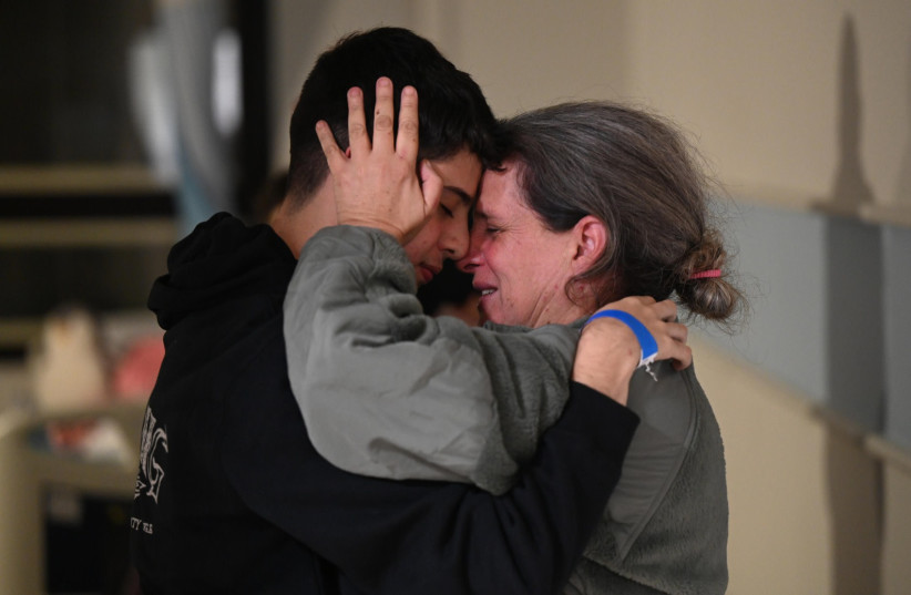  Members of the Avigdori family reunite at Sheba  Hospital after over a month of separation, November 26, 2023. (credit: CHAIM TZACH/GPO)