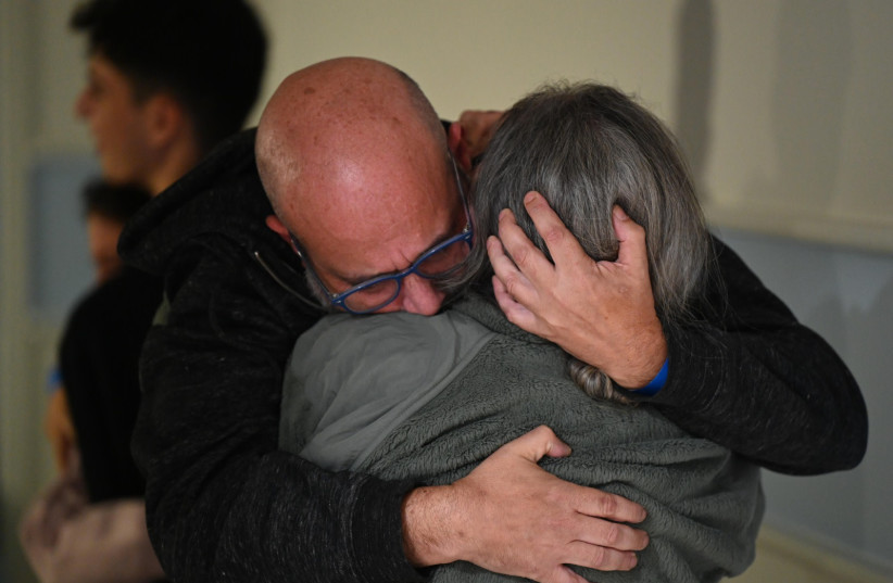  Members of the Avigdori family reunite at Sheba Hospital after over a month of separation, November 26, 2023. (credit: CHAIM TZACH/GPO)