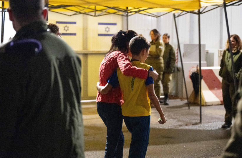  Documentation from the moment Eitan Yahami met his mother, upon his return tonight, at the meeting point in Kerem Shalom. (credit: IDF SPOKESPERSON'S OFFICE)