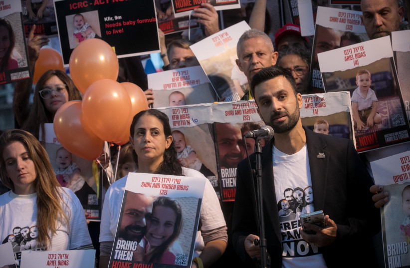  Yoseph Haddad speaks at a press conference calling for the release of 10 month old Kfir, 4 year old Ariel, and their parents Shiri and Yarden Bibas. at  ''Hostage Square'' in Tel Aviv, November 28, 2023.  (credit: MIRIAM ALSTER/FLASH90)