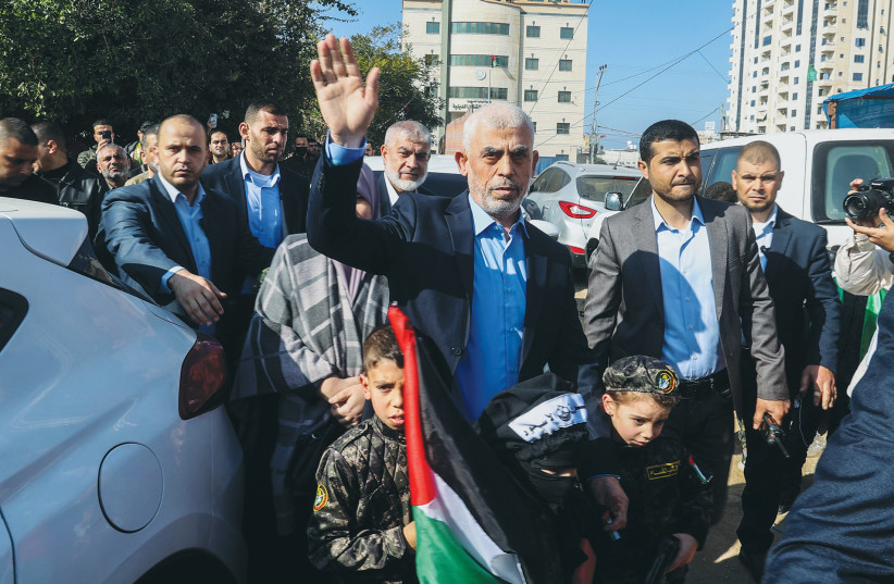  YAHYA SINWAR, leader of Hamas in Gaza, attends a rally in Gaza City marking the terror organization's 35th anniversary last December. Sinwar has once again aimed the arrow at Israel's Achilles' heel, argues the writer. (credit: ATIA MOHAMMED/FLASH90)