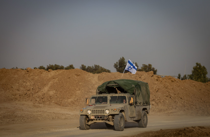 Israeli soldiers patrol near the Israeli-Gaza border, southern Israel, November 23, 2023.